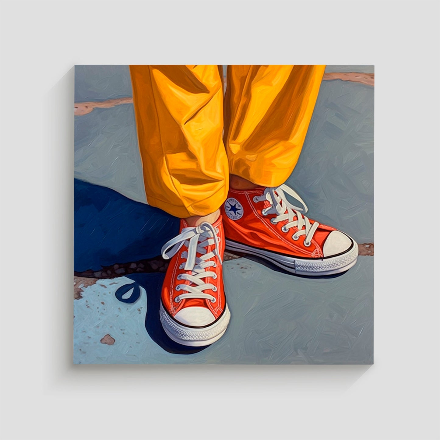 Imagen de un par de zapatillas Converse rojas con cordones blancos, combinadas con pantalones amarillos brillantes. La foto destaca el contraste de colores vibrantes en una pose casual sobre un fondo de asfalto.