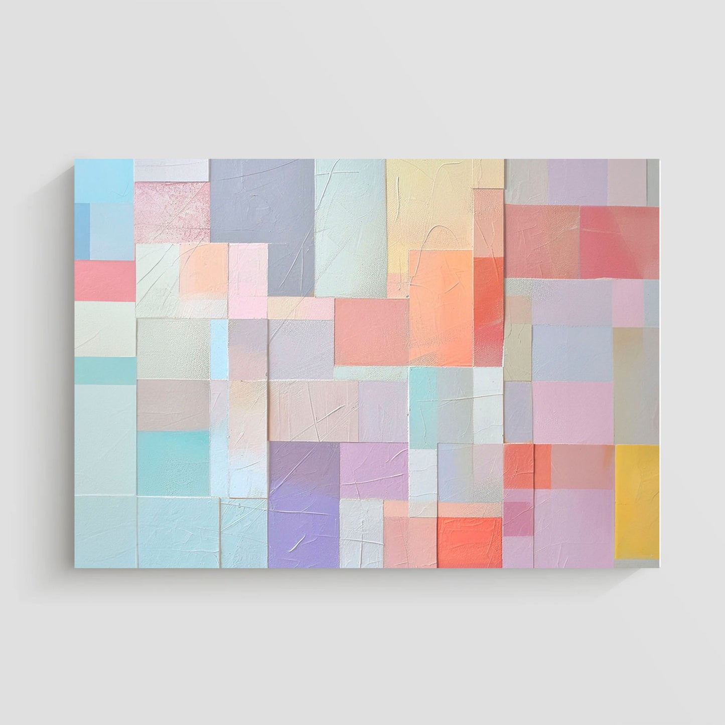 Imagen abstracta con un patrón de bloques geométricos en tonos pastel suaves, incluyendo rosa, lila, azul y coral, dispuestos en un diseño texturizado. Ideal para agregar un toque moderno y sofisticado a la decoración de interiores.