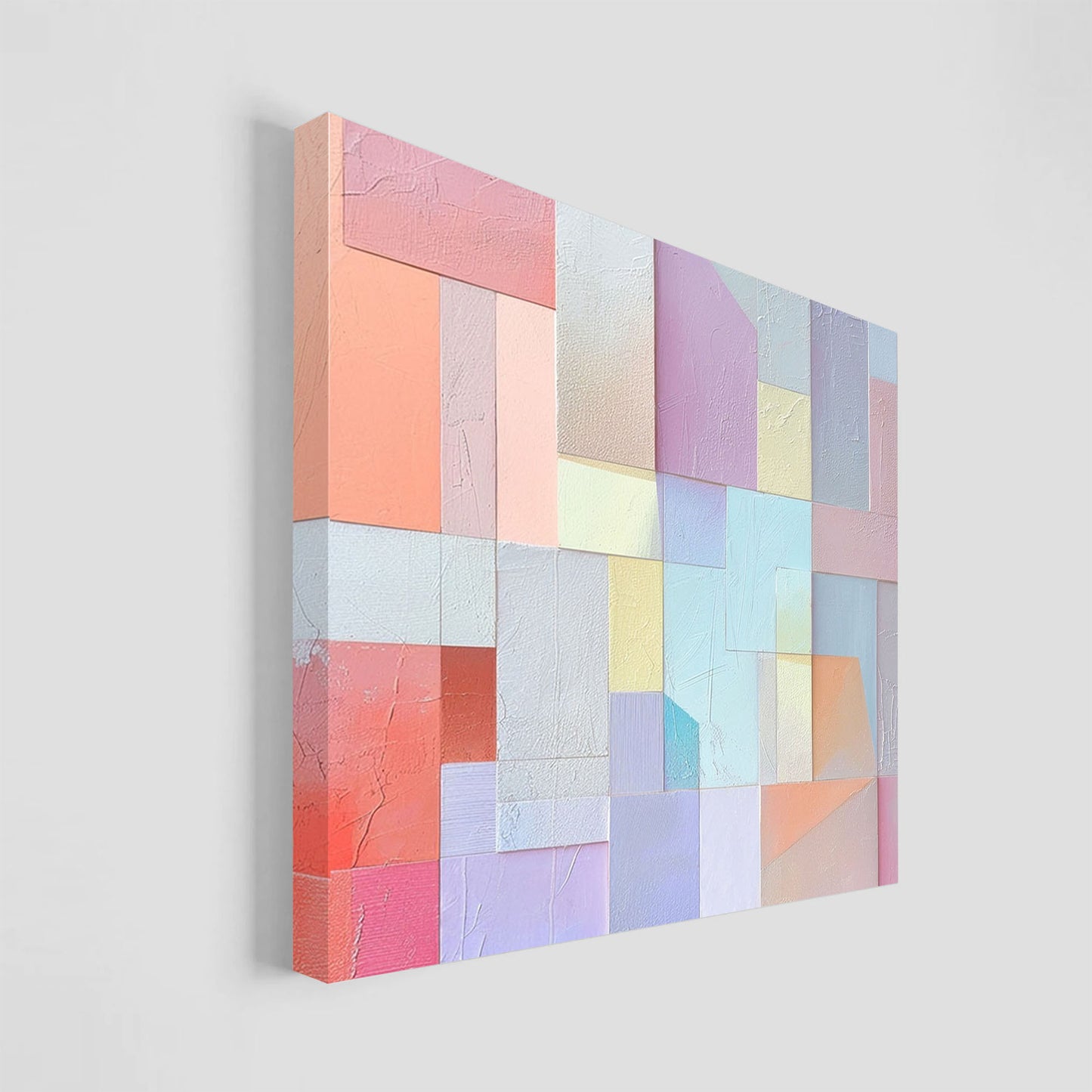 Imagen abstracta con un patrón de bloques geométricos en tonos pastel suaves, incluyendo rosa, lila, azul y coral, dispuestos en un diseño texturizado. Ideal para agregar un toque moderno y sofisticado a la decoración de interiores.
